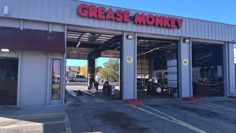 Renovated exterior of Grease Monkey oil change center with updated signage, fresh paint, and modern branding.
